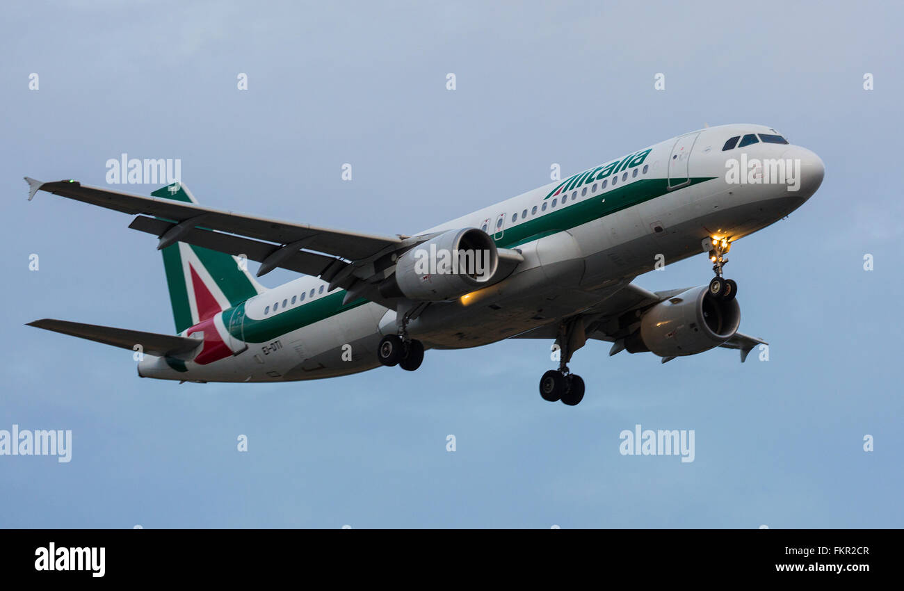 Allitalia (Italian Airlines) Aeroplane landing at London Heathrow airport Stock Photo