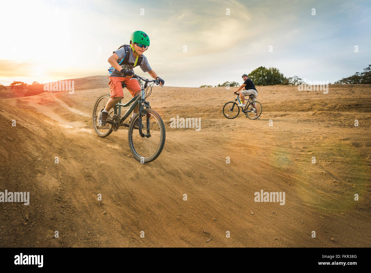 Boy riding dirt bikes on track Stock Photo - Alamy