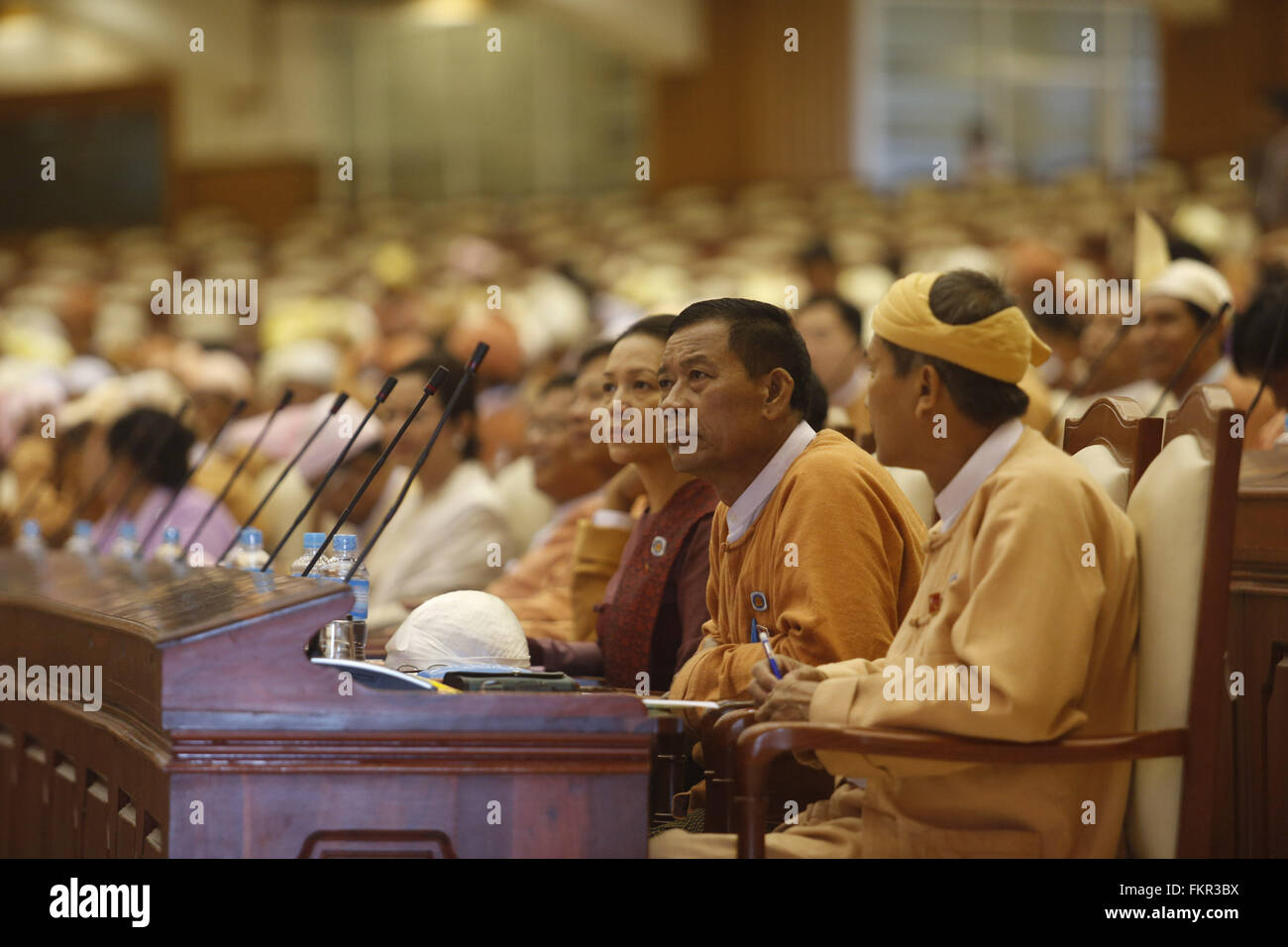 Nay Pyi Taw, Myanmar. 10th Mar, 2016. People attend a session of the House of Representatives (Lower House) in Nay Pyi Taw, Myanmar, March 10, 2016. The presidential election process kicked off in Myanmar's parliament Thursday as three parliamentary groups of presidential electoral college have submitted their candidates. Credit:  U Aung/Xinhua/Alamy Live News Stock Photo