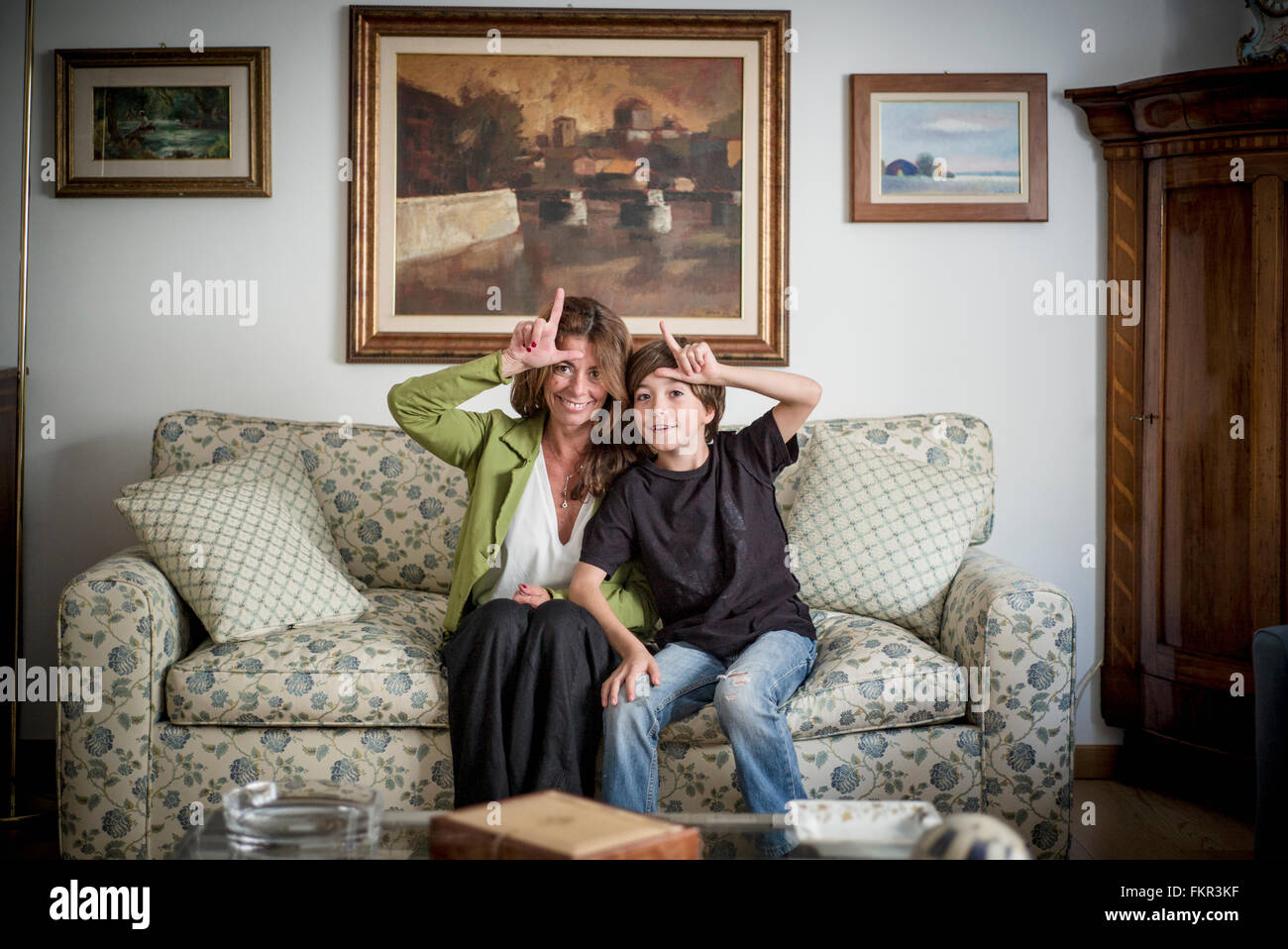 Caucasian grandmother and grandson gesturing loser Stock Photo