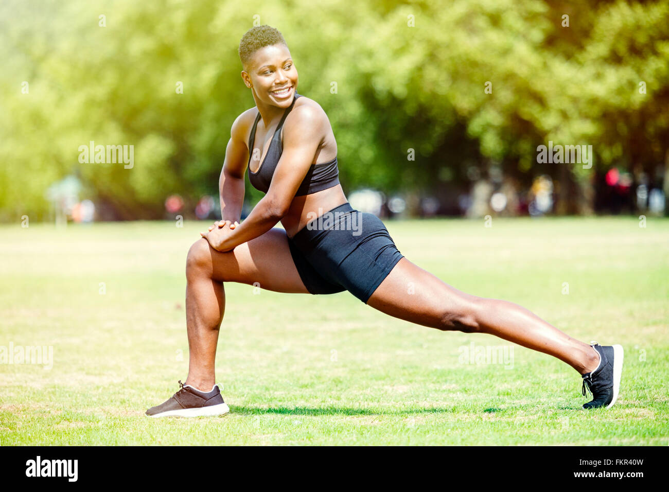 Athlete stretching in grass hi-res stock photography and images - Alamy