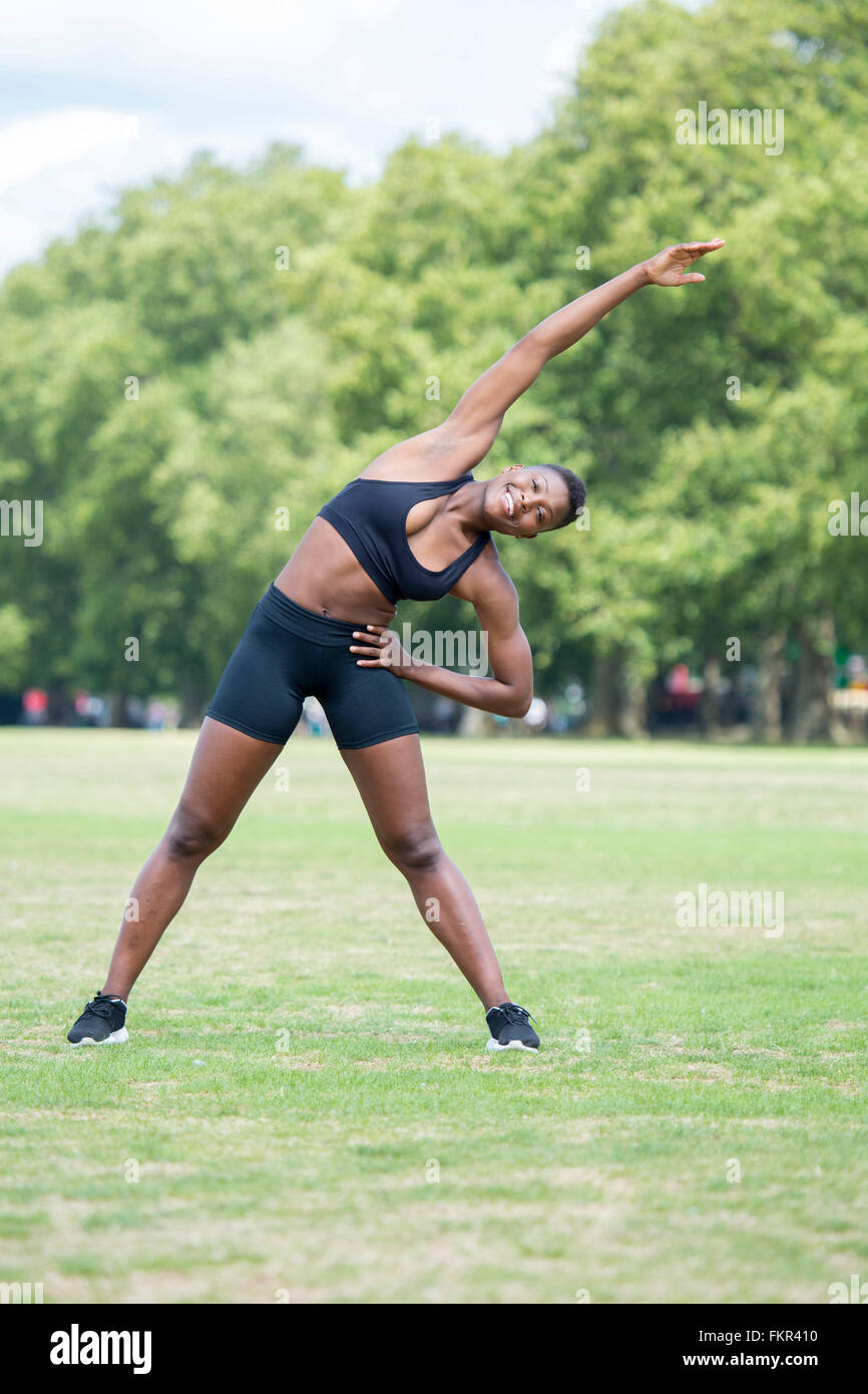 Black athlete stretching in park Stock Photo