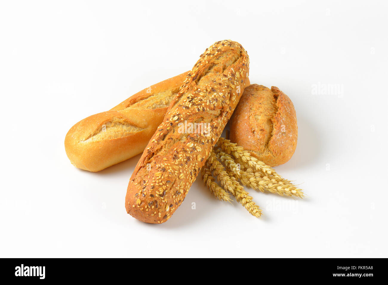 freshly baked bread rolls on white background Stock Photo