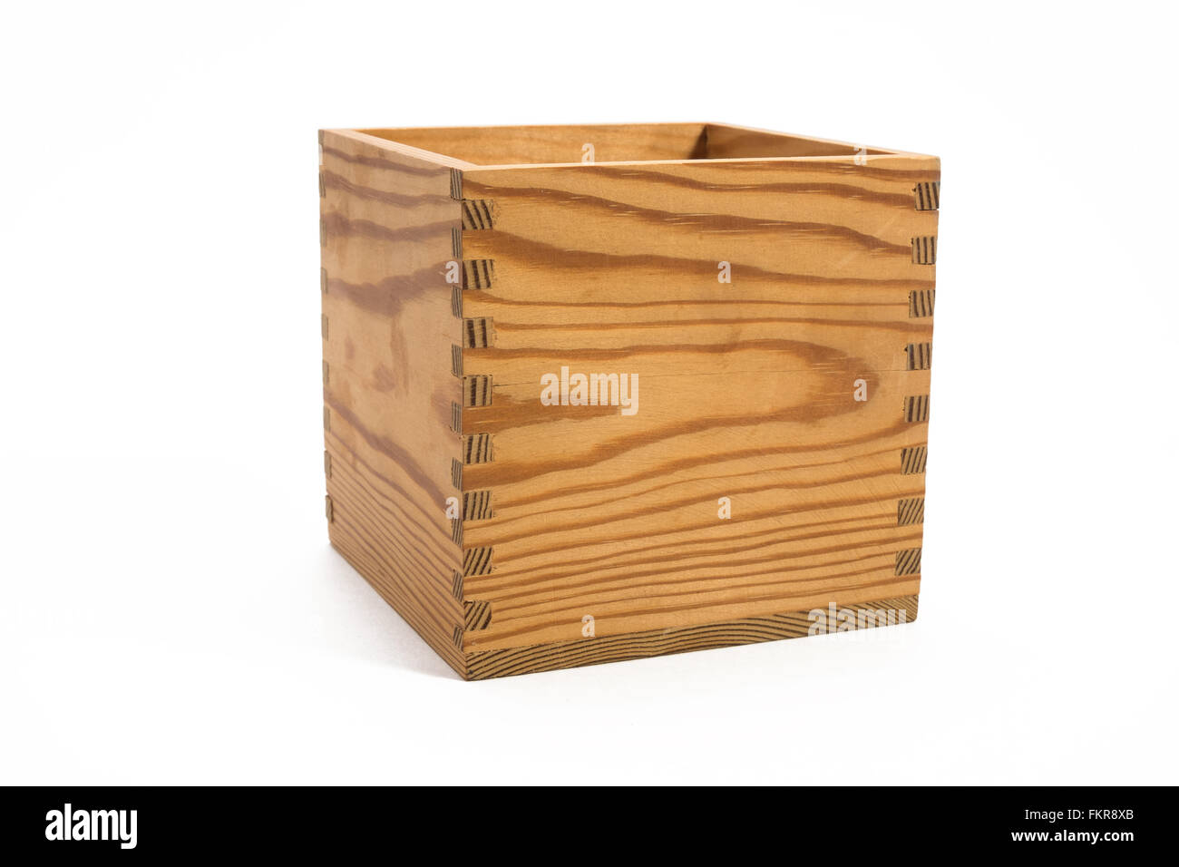 wood box standing on white surface, the opening is facing up Stock Photo