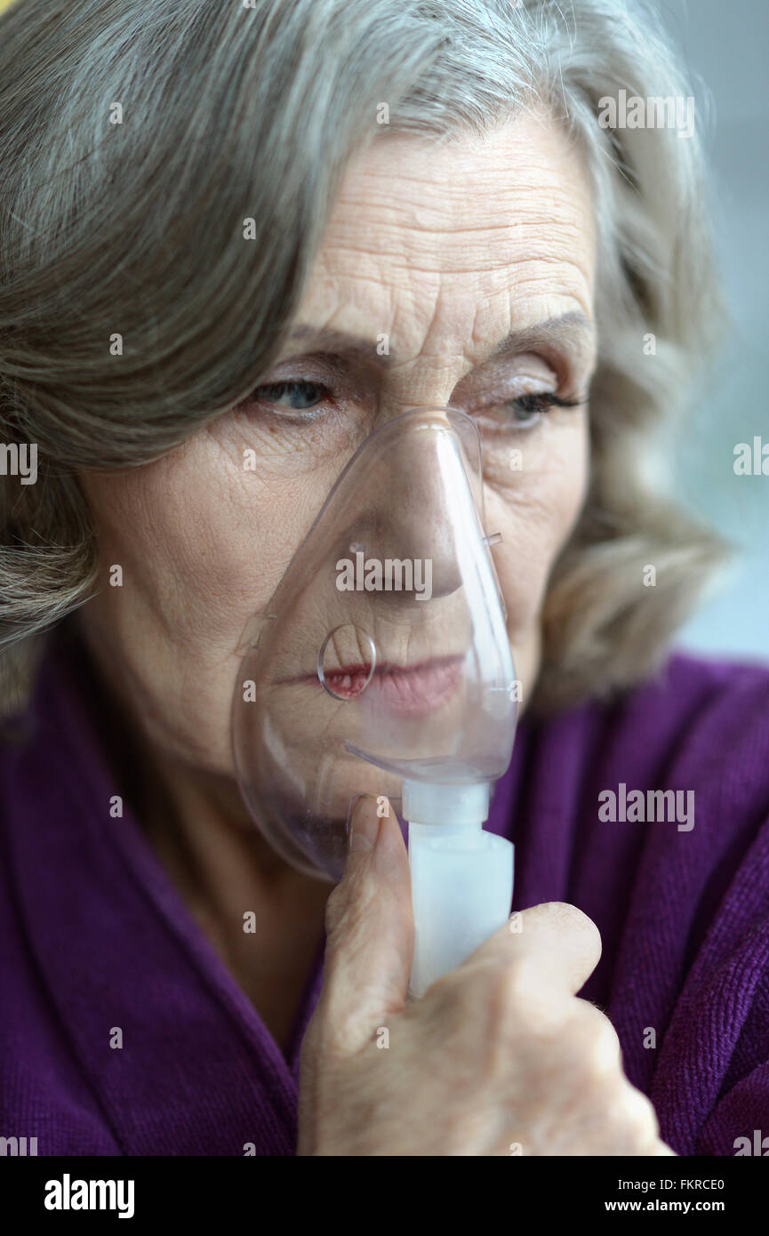 woman with inhaler Stock Photo Alamy