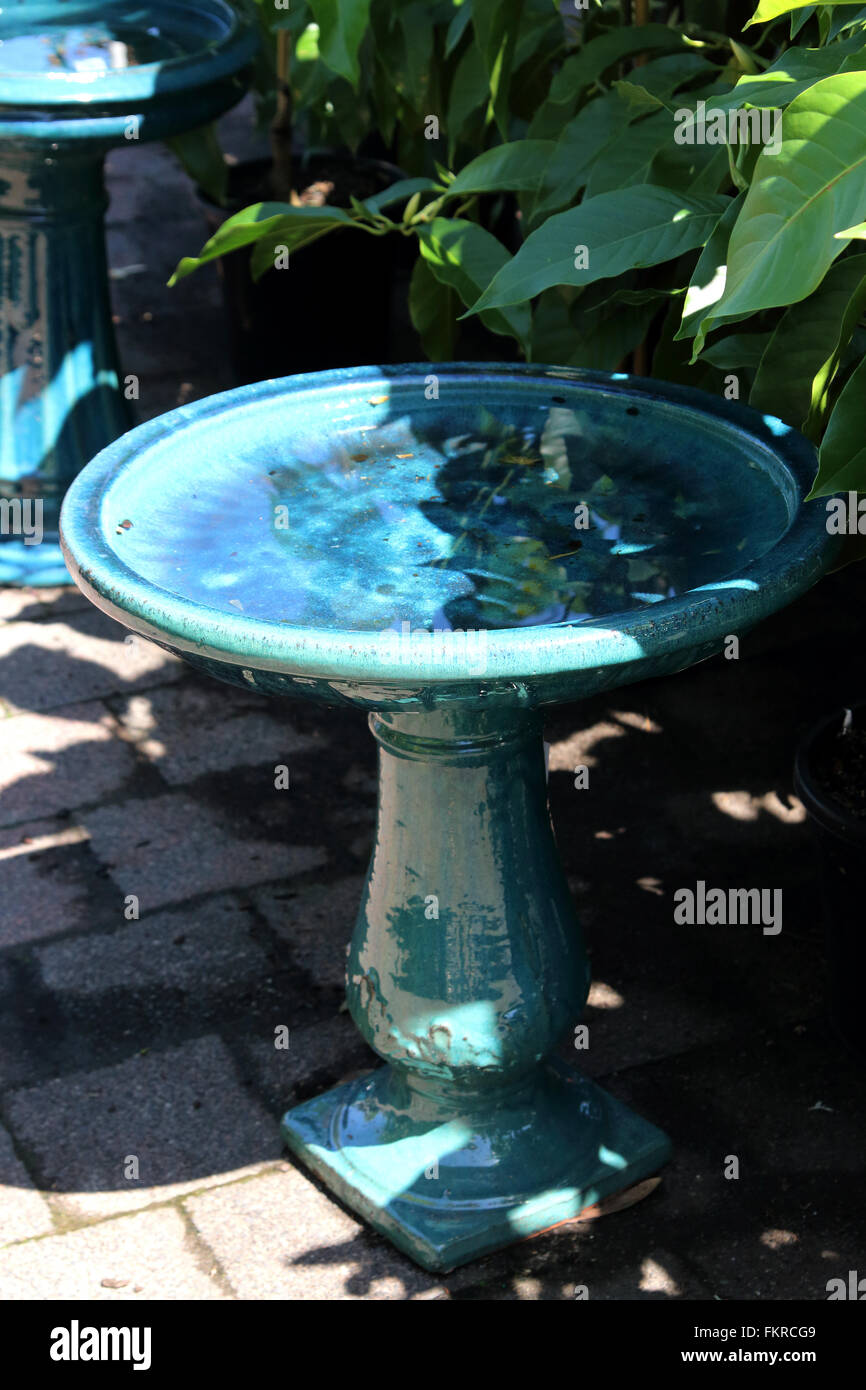 Ceramic blue bird bath Stock Photo