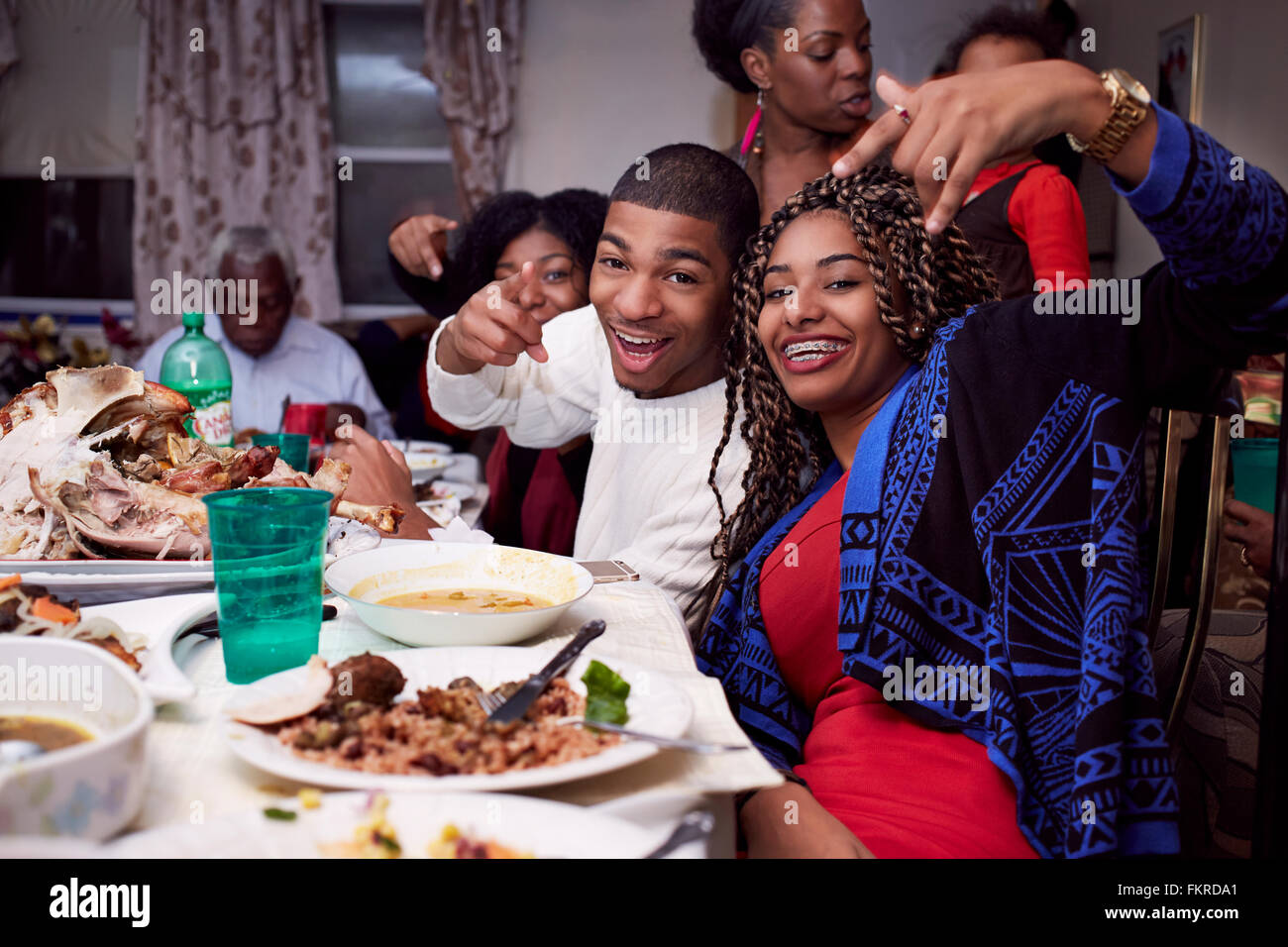 Brother and sister posing at dinner table Stock Photo Alamy