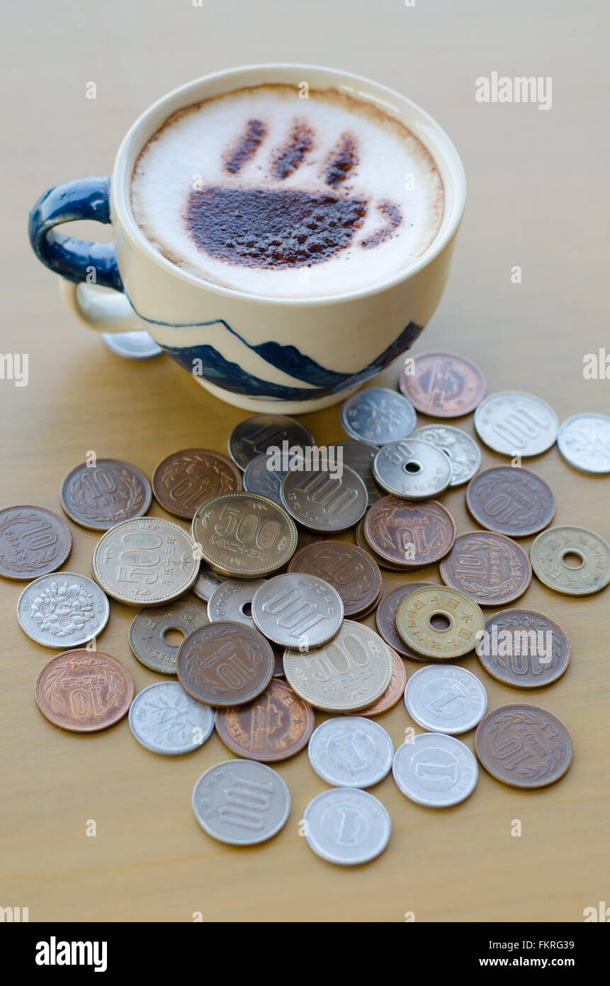 Hot coffee and Japanese yen coin Stock Photo Alamy