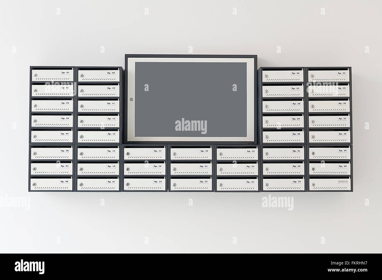 Mailboxes for apartment building with a notification board Stock Photo