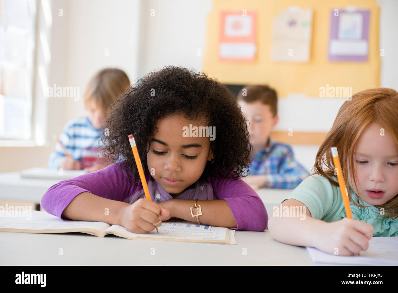 Students working in classroom Stock Photo