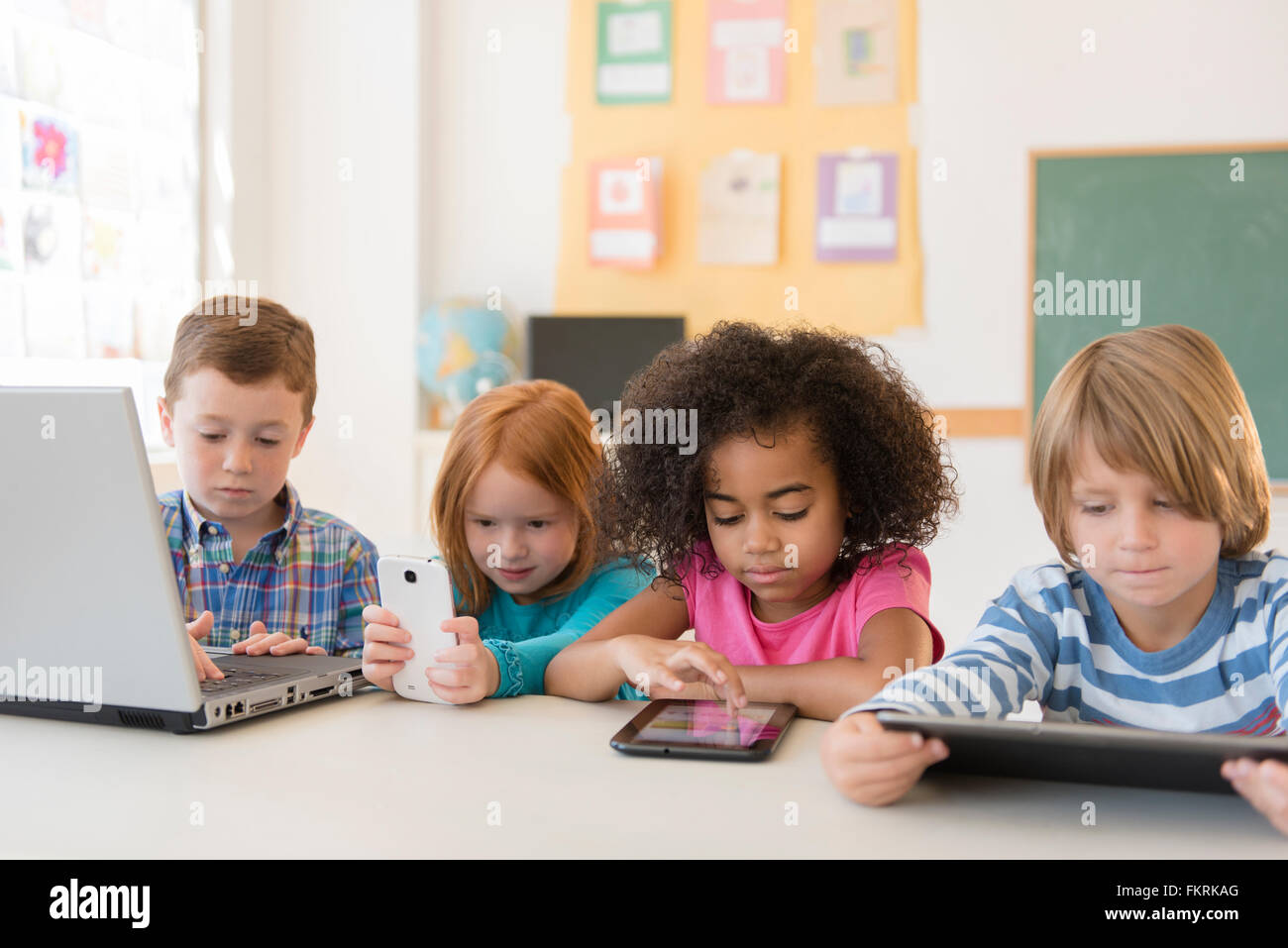 Students using technology in classroom Stock Photo - Alamy