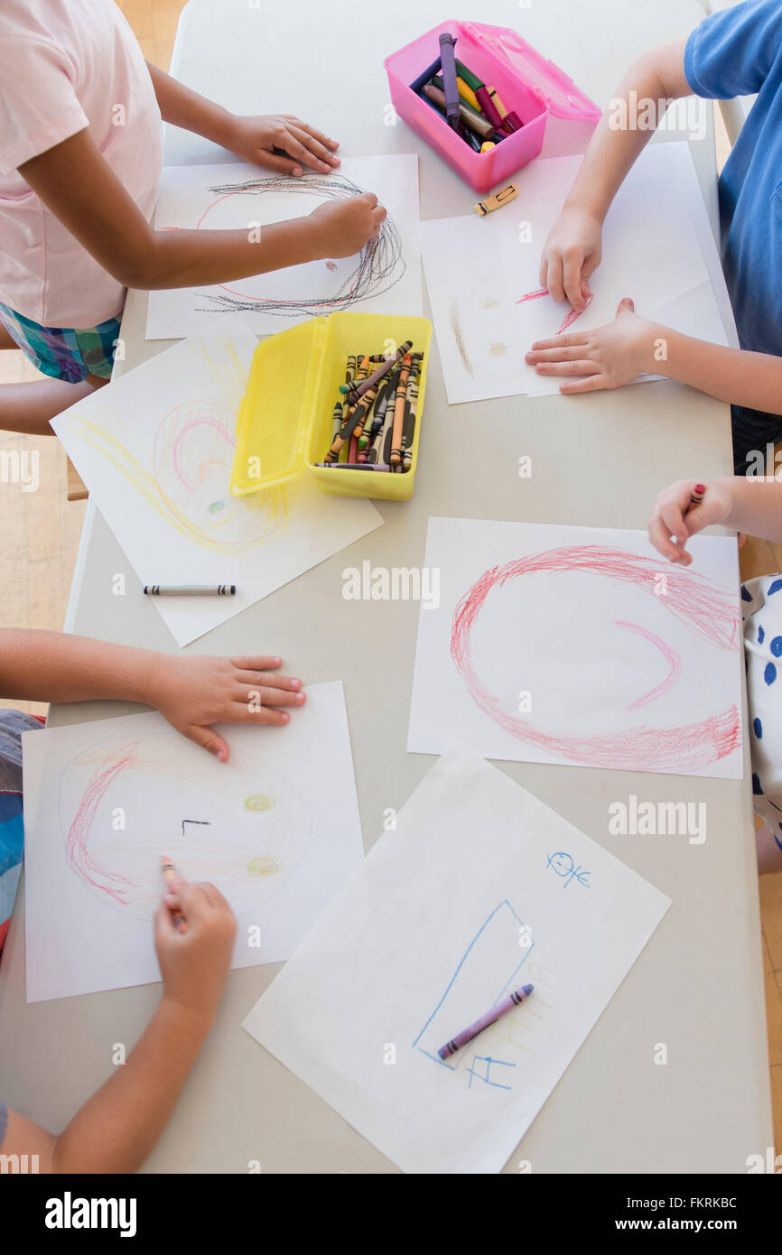Students drawing in classroom Stock Photo