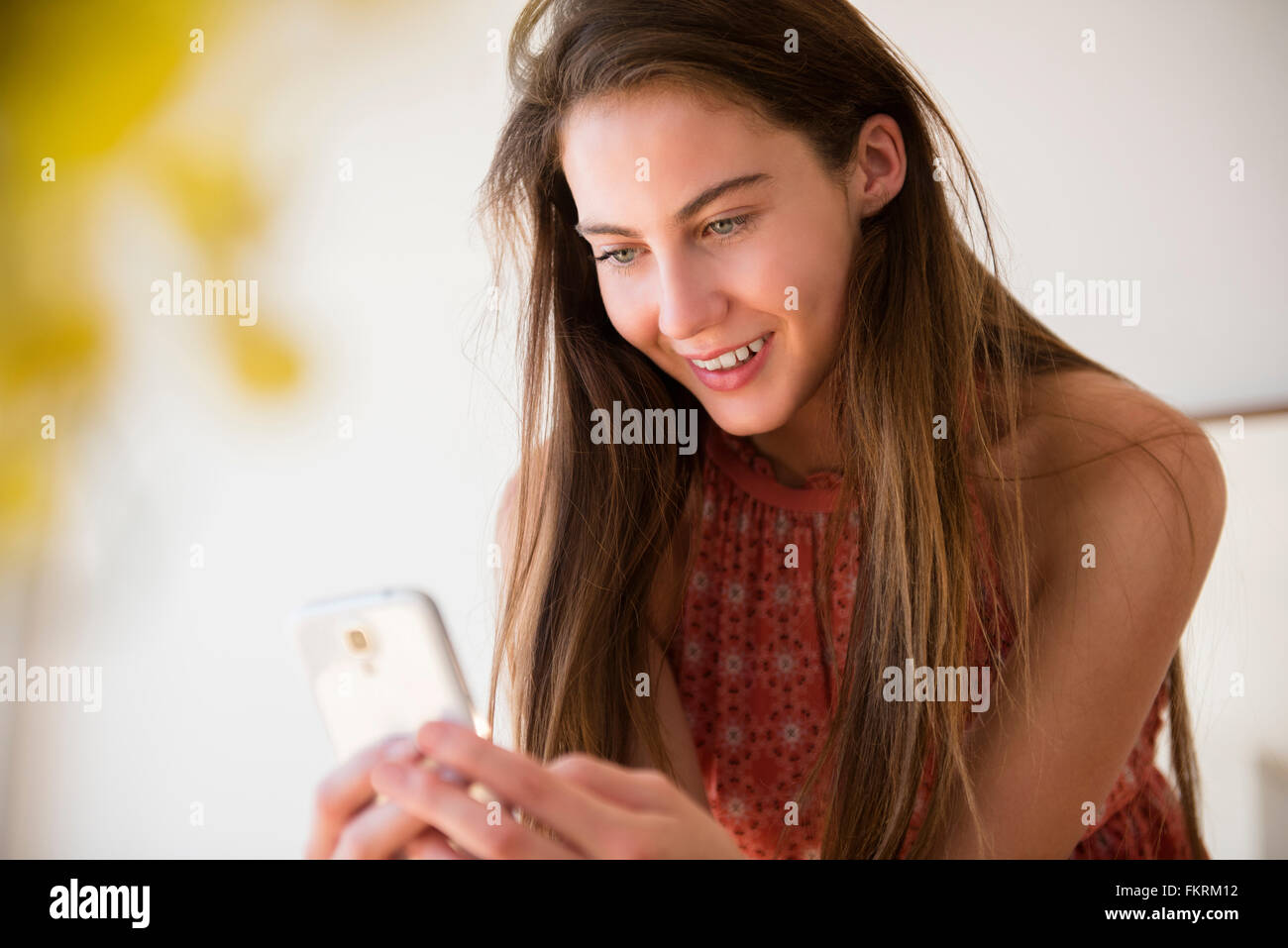 Native American woman using cell phone Stock Photo