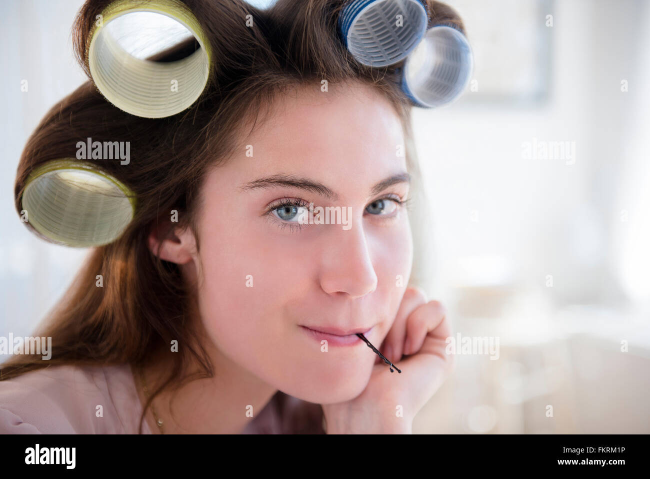 Native American woman with curlers in hair Stock Photo