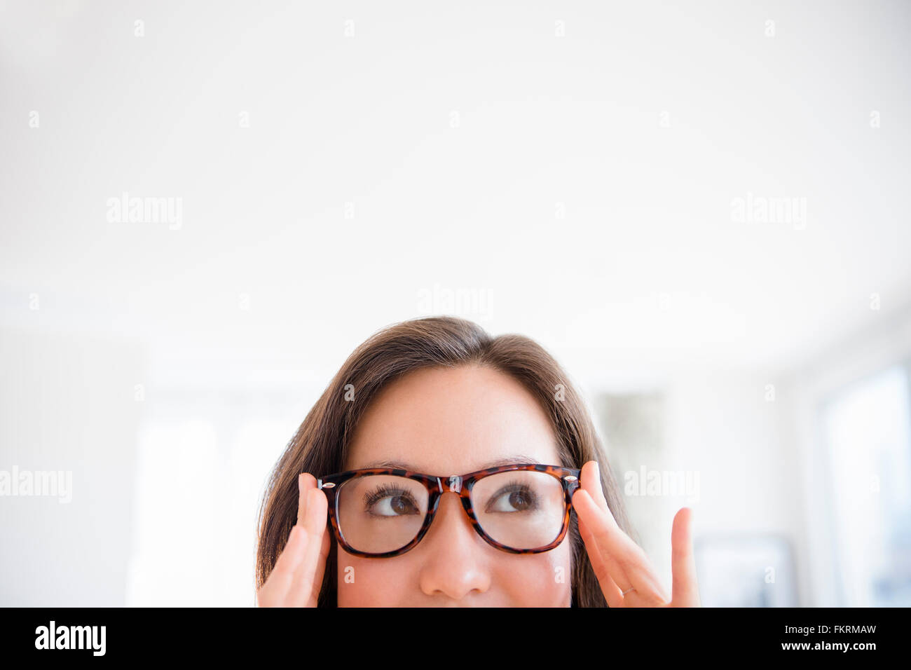 Mixed race woman wearing eyeglasses Stock Photo