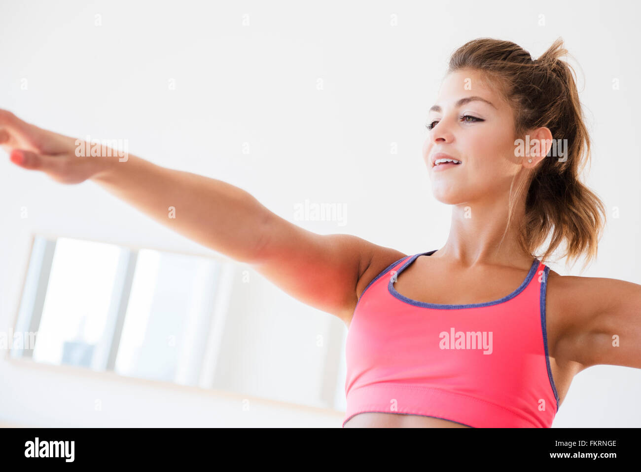 Mixed race woman working out Stock Photo