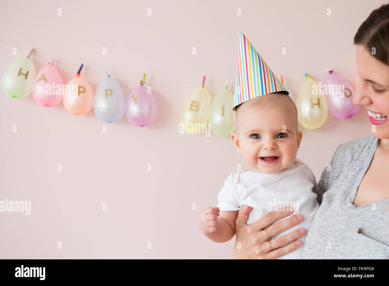 Caucasian mother and daughter celebrating birthday Stock Photo