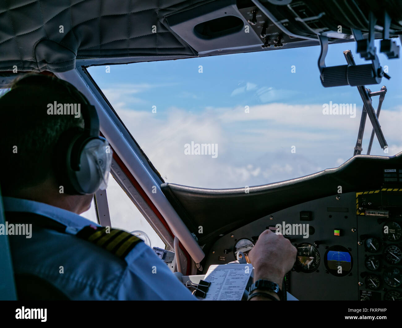 Rear view of pilot and copilot in cockpit Stock Photo