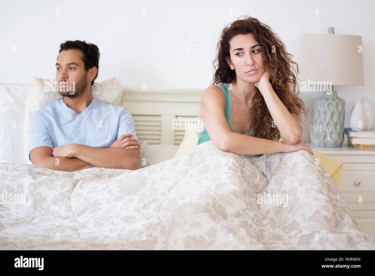 Couple arguing in bed Stock Photo
