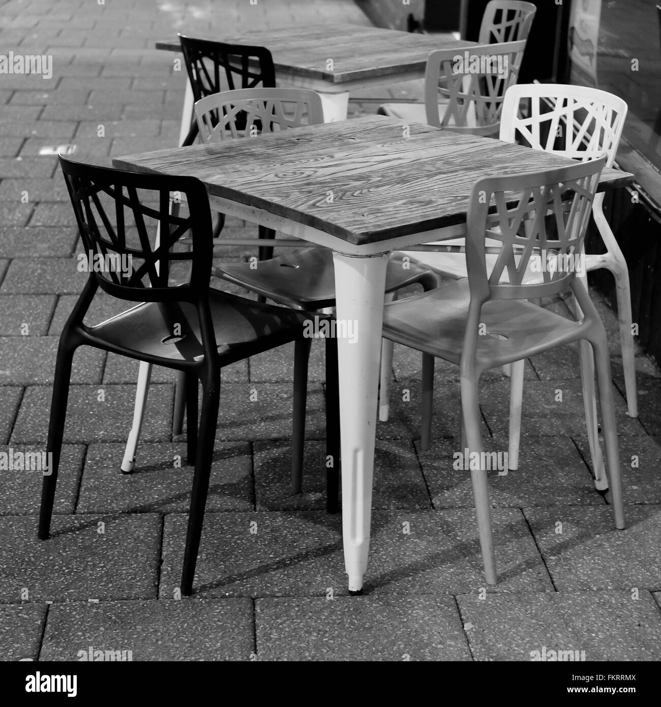 Pavement tables and chairs outside a cafe in Falmouth, Cornwall Stock Photo