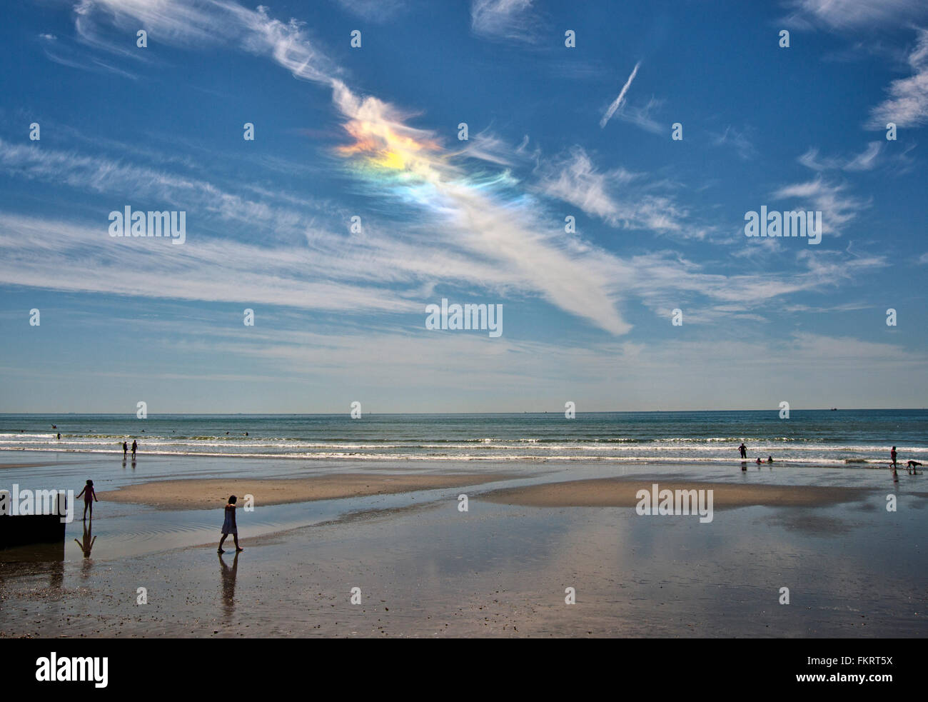 Iridescent clouds, East Wittering Beach, South Coast England, UK Stock Photo