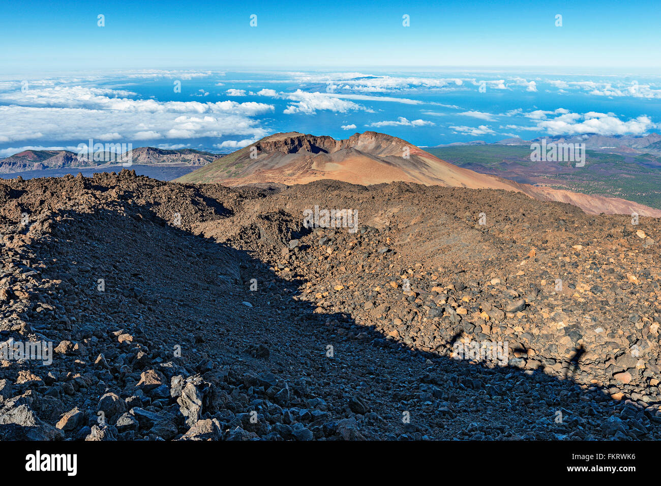 Hiking trail descents through sharp lava rocks from the top of Teide volcano (3718 m). Stock Photo