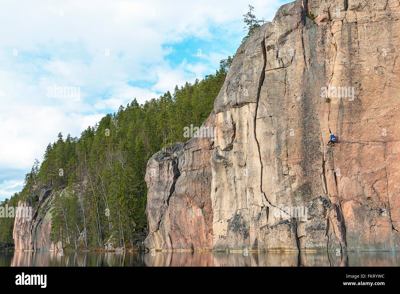 Rock climbers at Olhava cliff. Repovesi National Park, Finland. Stock Photo
