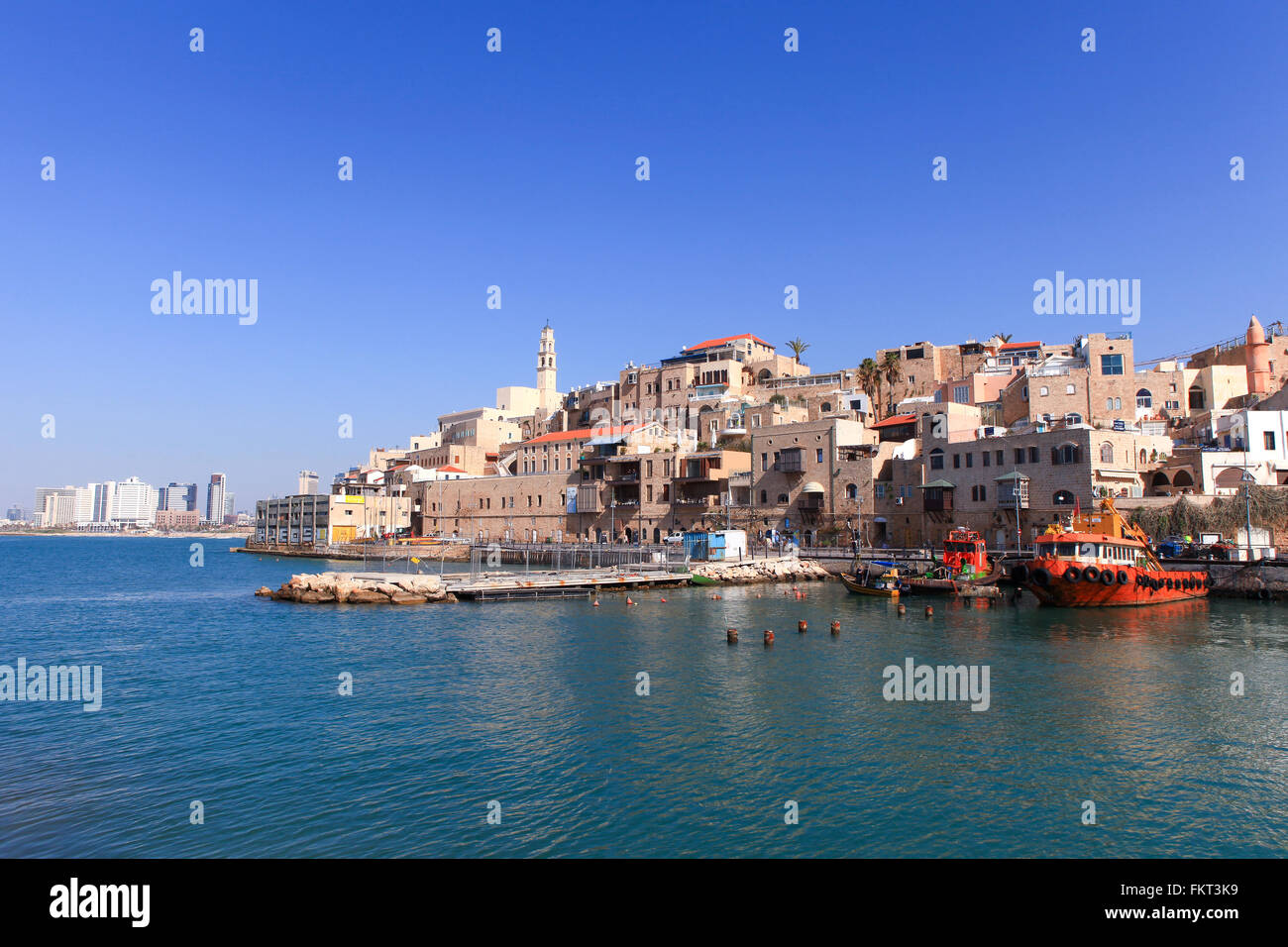 Old port of Jaffa with Tel Aviv's skyline in the background Stock Photo