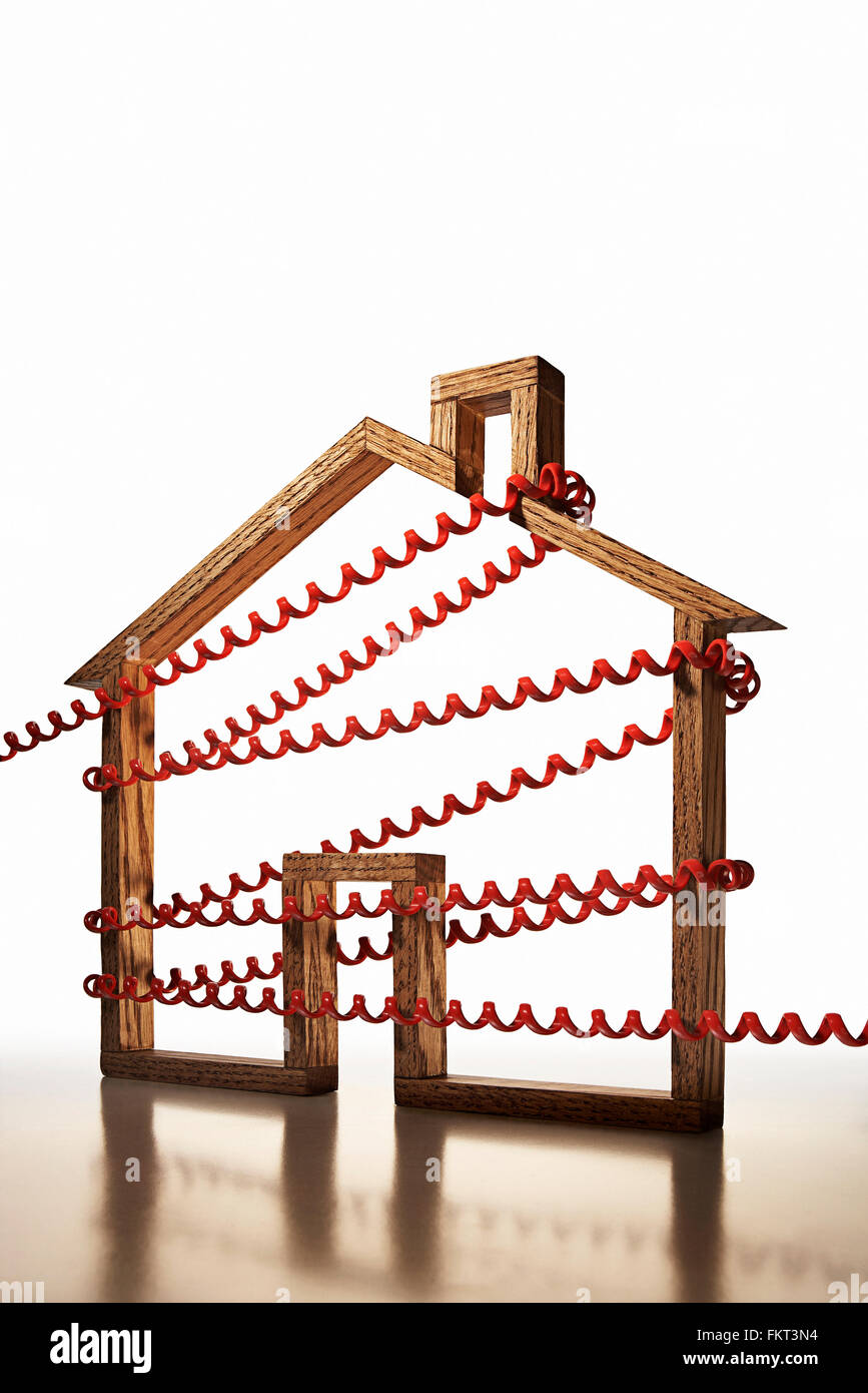 House shape wrapped in phone cord Stock Photo