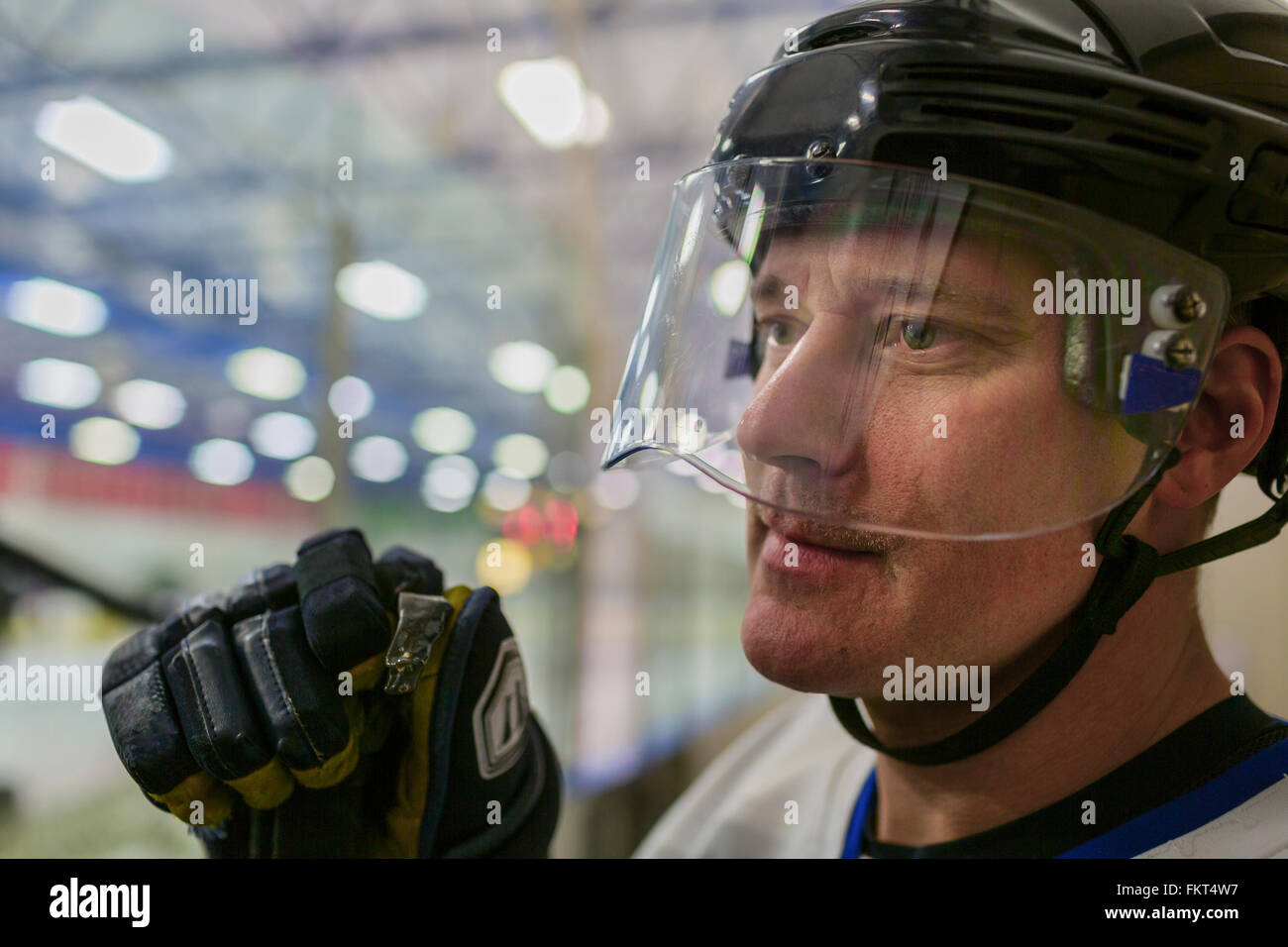 Caucasian hockey player wearing helmet Stock Photo Alamy