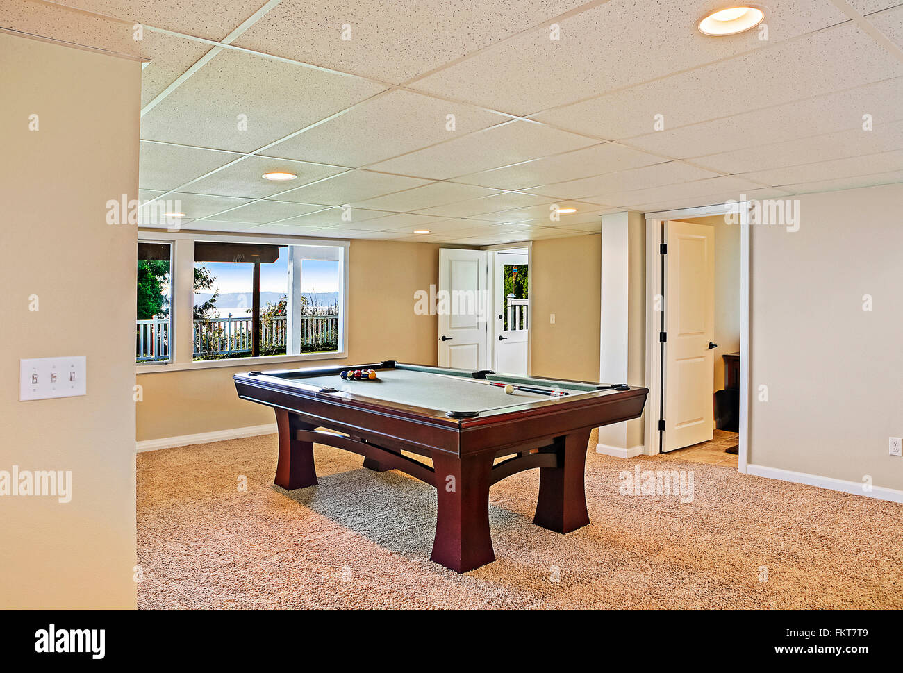Pool table in game room Stock Photo Alamy
