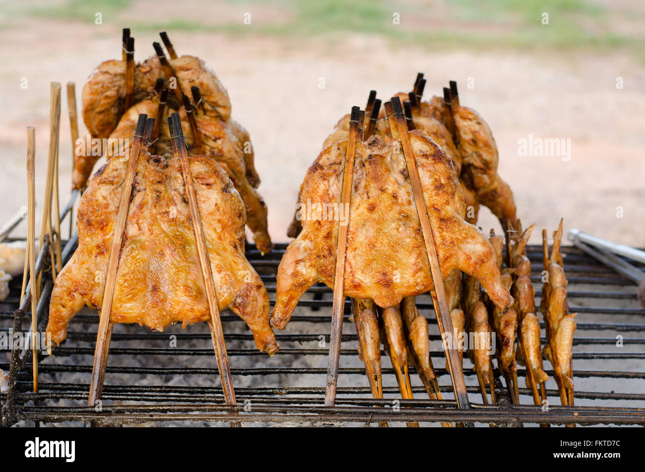 Thai-style chicken grilled on charcoal Stock Photo