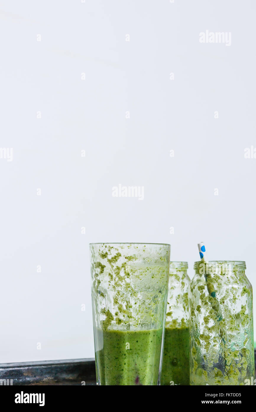 empty glasses of green smoothie Stock Photo