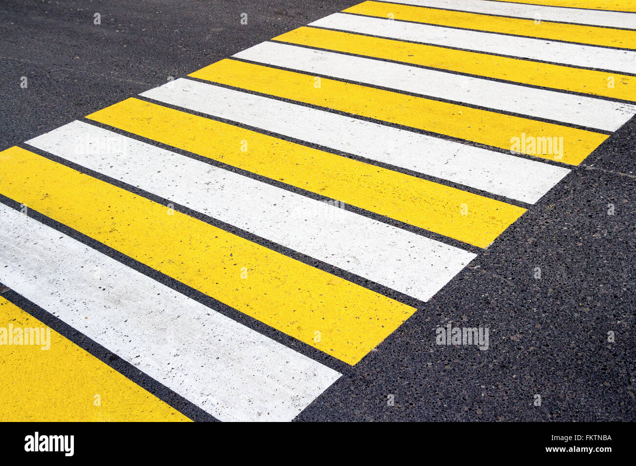 Zebra crossing with white and yellow lines Stock Photo Alamy