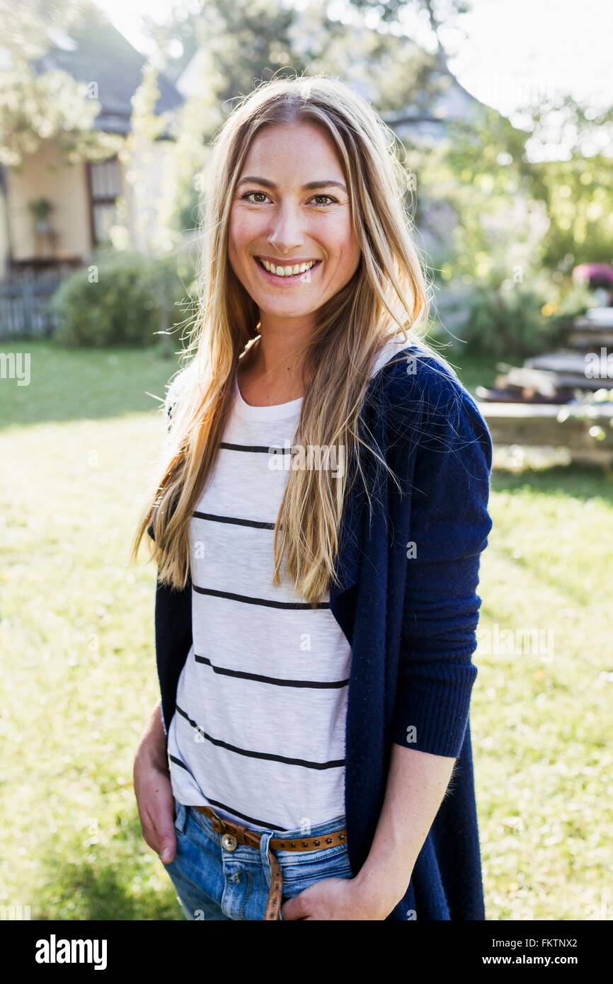 Mid adult woman smiling towards camera, portrait Stock Photo