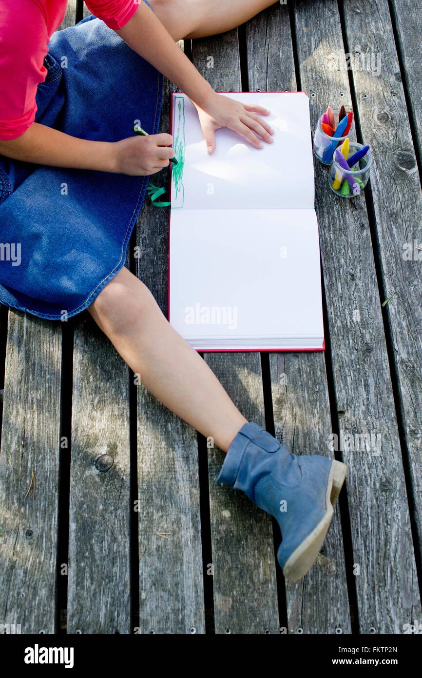 Girl drawing picture, high angle view Stock Photo
