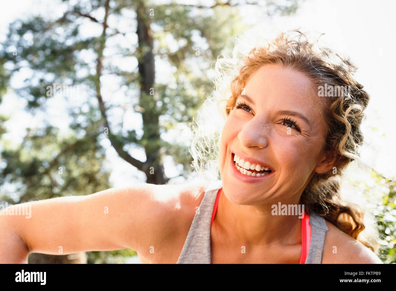 Young woman looking away smiling, portrait Stock Photo
