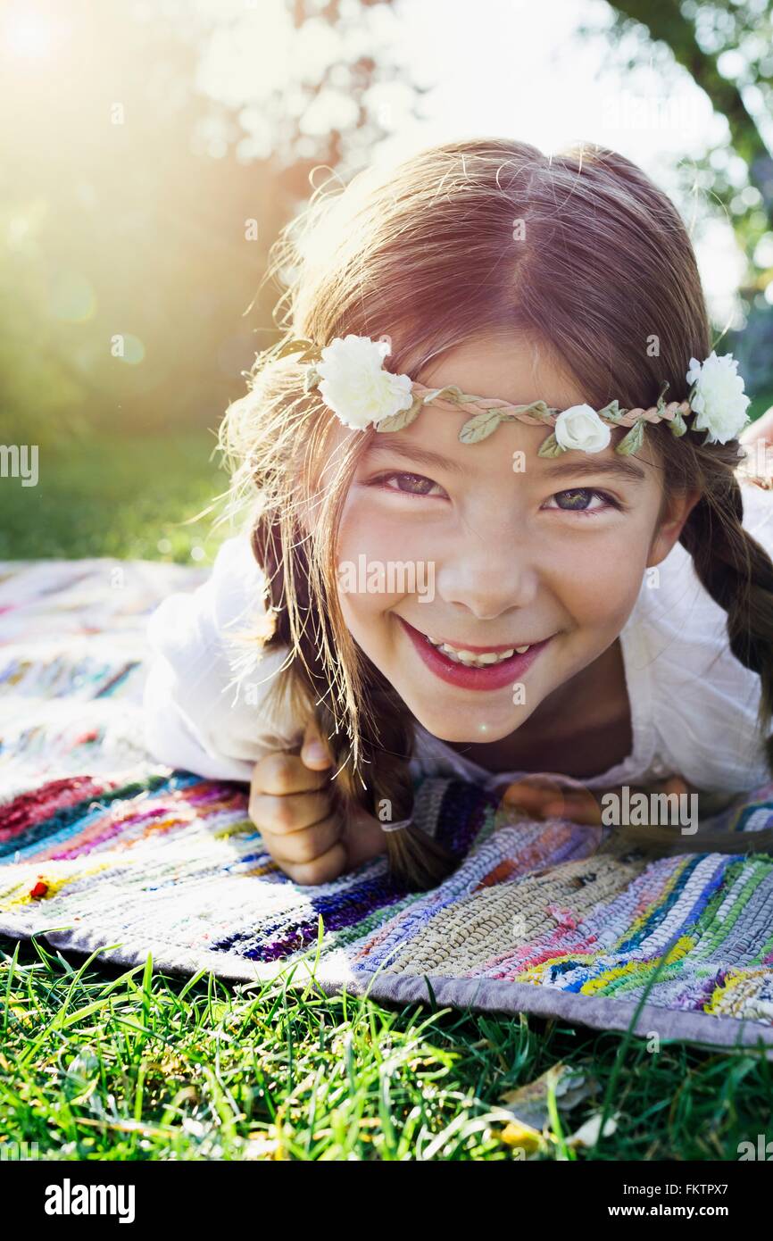 Girl with flowers round head, portrait Stock Photo
