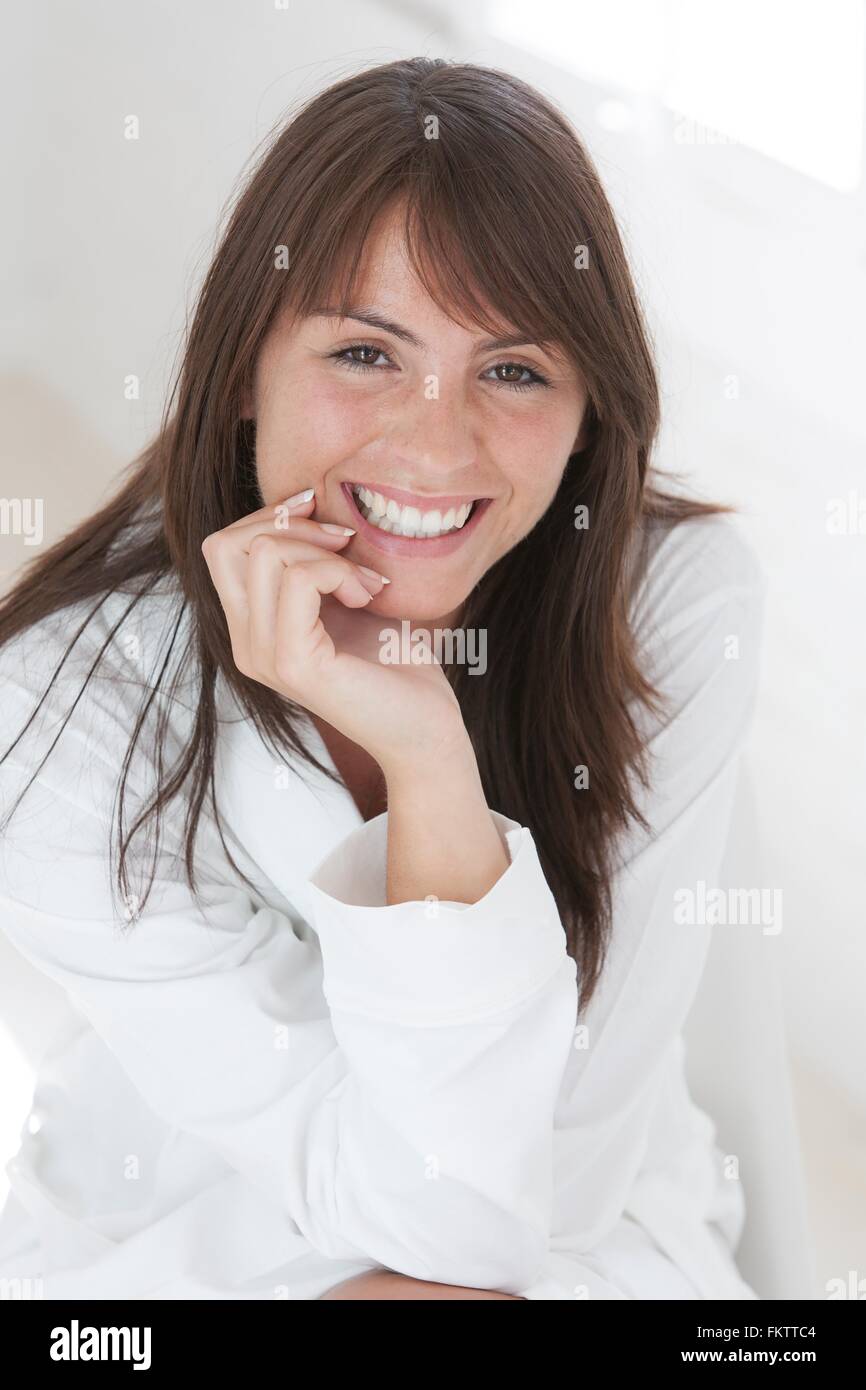 Portrait of beautiful young woman with long brown hair Stock Photo - Alamy