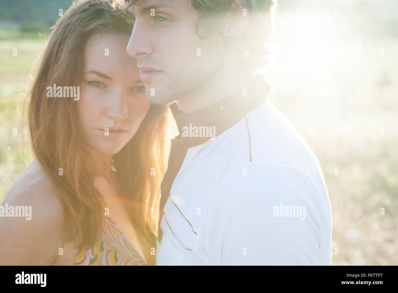 Sunlit portrait of sultry young couple Stock Photo