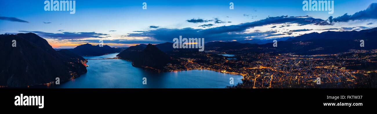 Panoramic high angle view of Lake Lugano at dusk, Switzerland Stock Photo