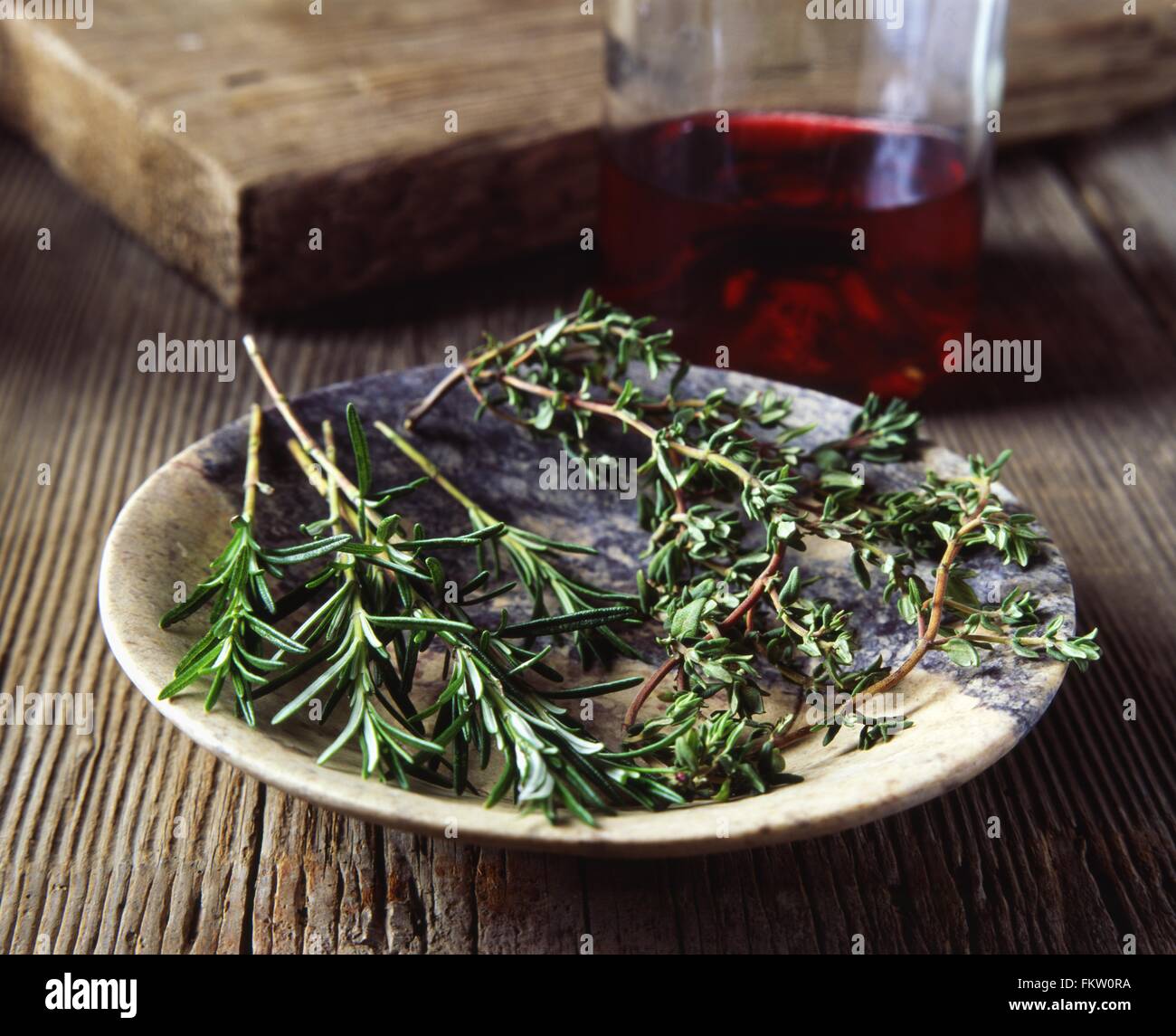Rosemary and thyme in vintage bowl hires stock photography and images