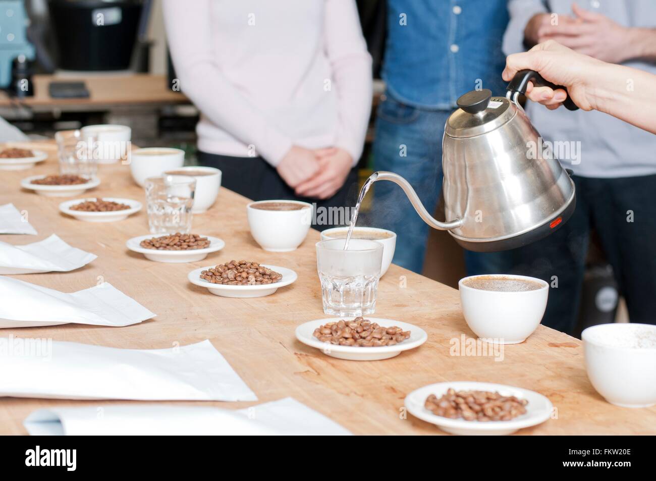 C fee seller pouring hot water into glass Stock Photo Alamy