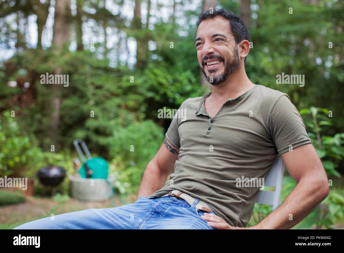 Mature man sitting in garden hi-res stock photography and images - Alamy
