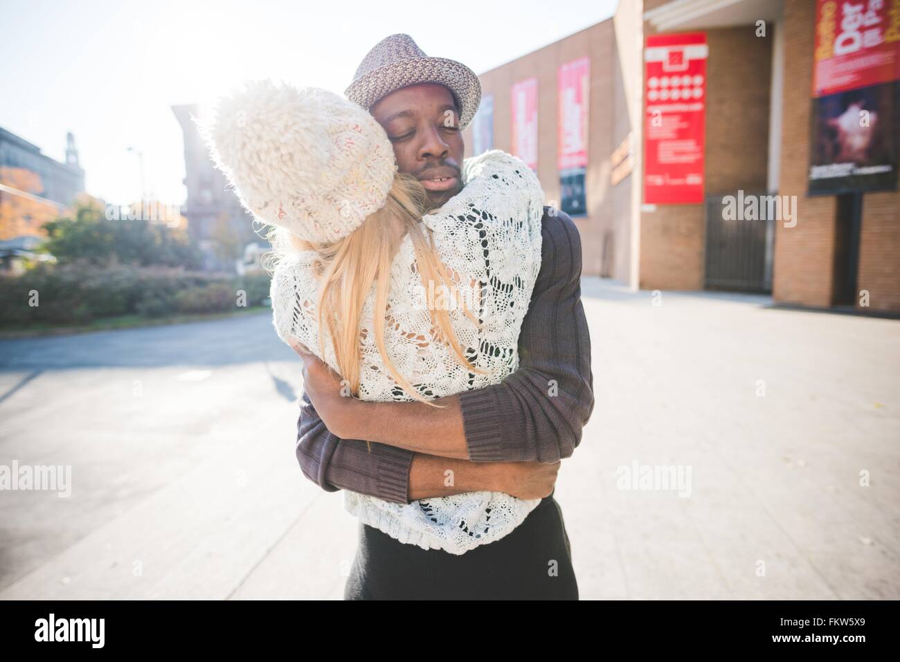 Couple hugging in park Stock Photo - Alamy