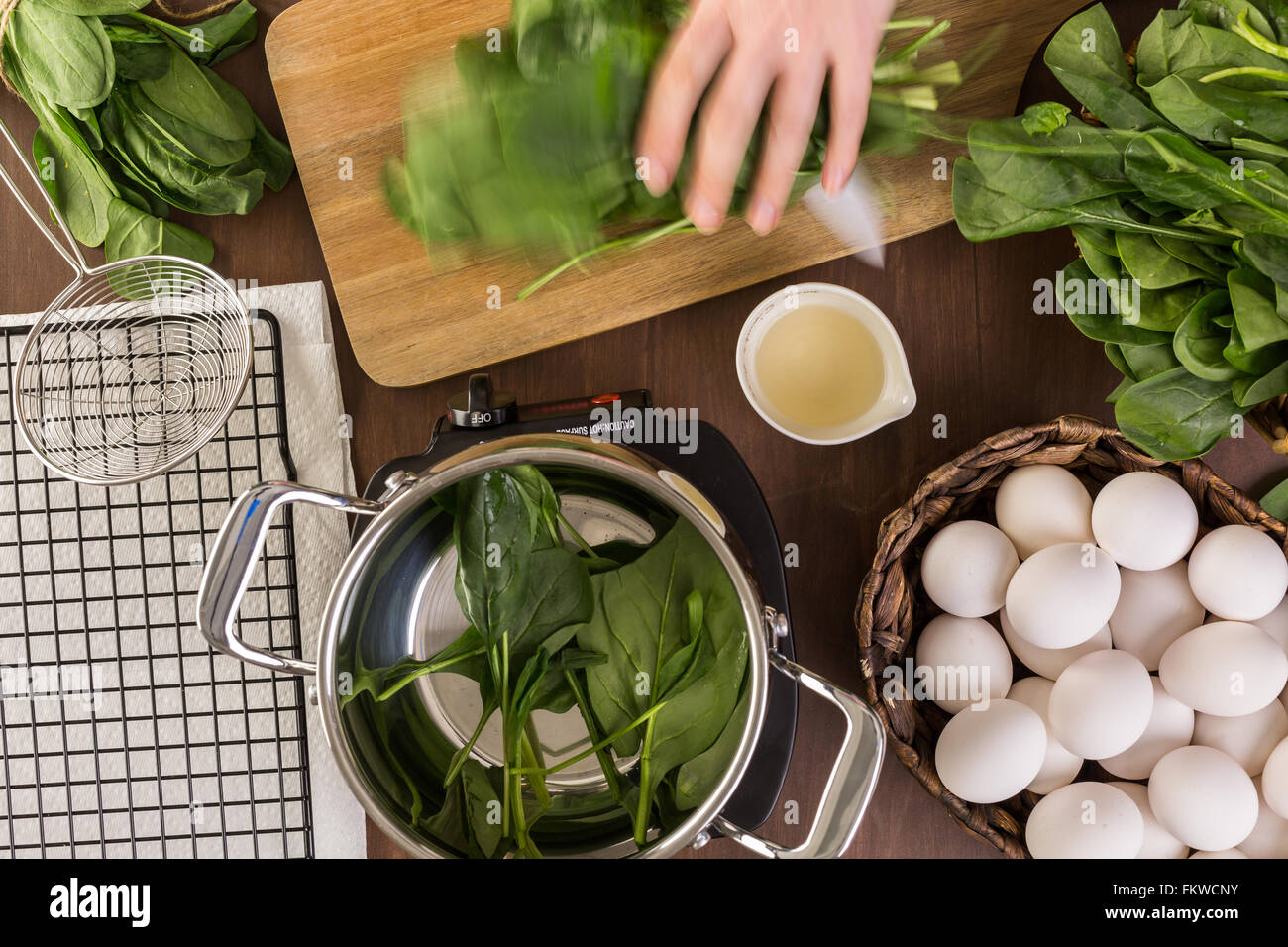 Dyeing Easter eggs with natural dye from spinach Stock Photo Alamy