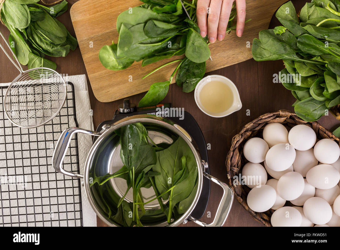 Dyeing Easter eggs with natural dye from spinach Stock Photo Alamy