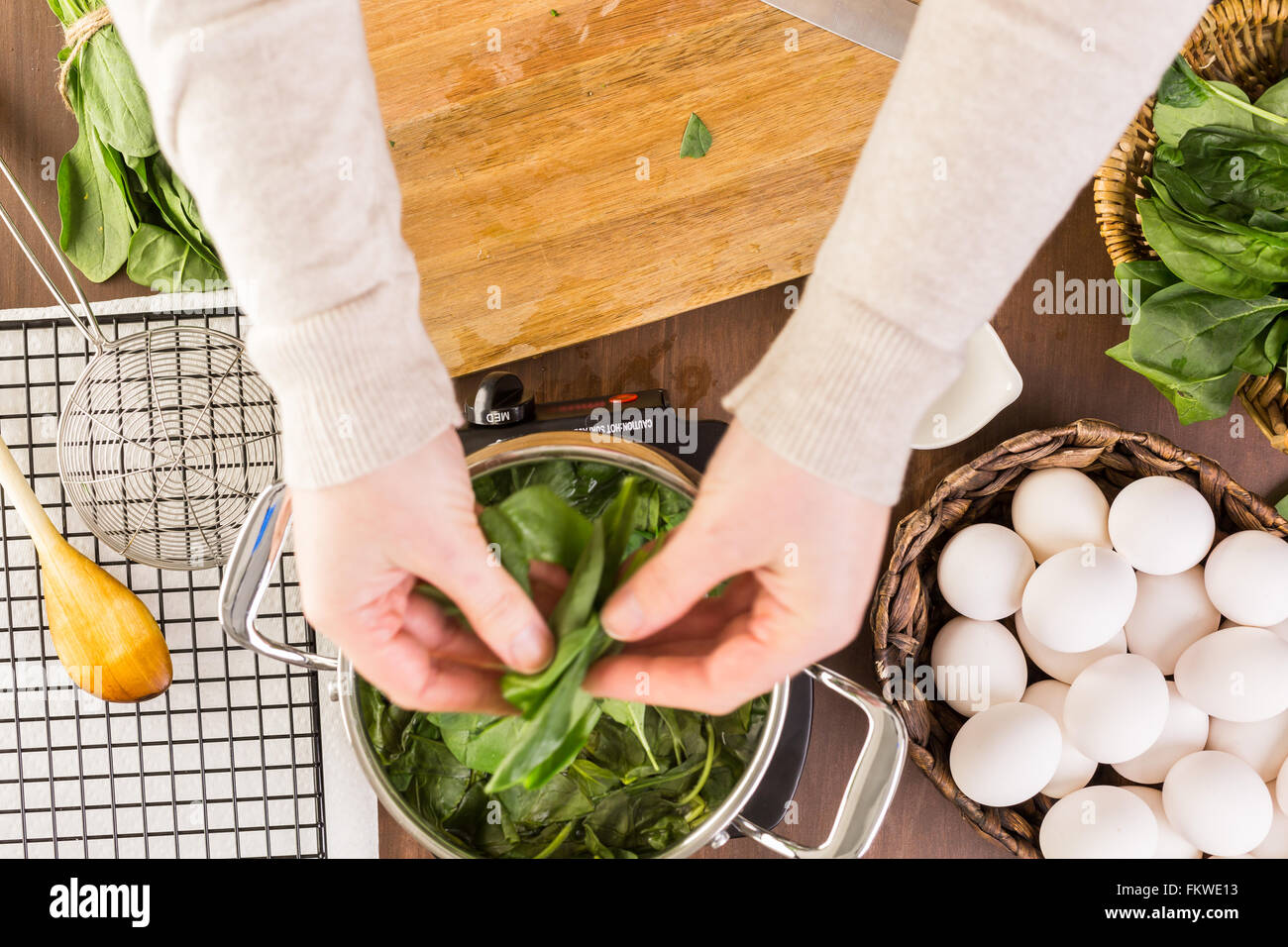 Dyeing Easter eggs with natural dye from spinach Stock Photo Alamy