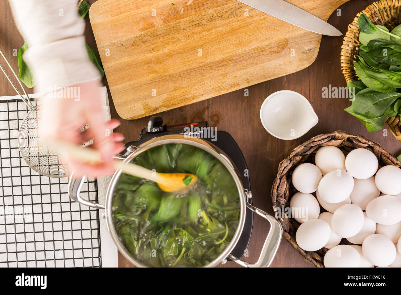 Dyeing Easter eggs with natural dye from spinach Stock Photo Alamy