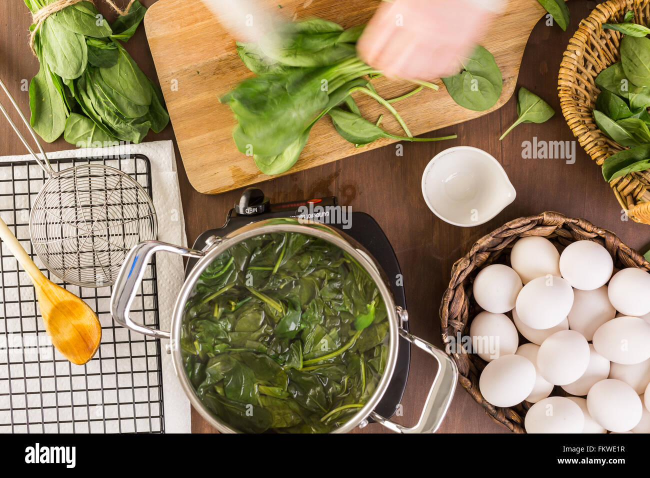 Dyeing Easter eggs with natural dye from spinach Stock Photo Alamy